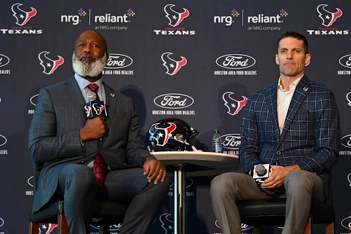 Feb 8, 2022; Houston, TX, USA; Houston Texans new head coach Lovie Smith (left) and general manager Nick Caserio (right) speak during the introductory press conference at NRG Stadium. Mandatory Credit: Maria Lysaker-USA TODAY Sports